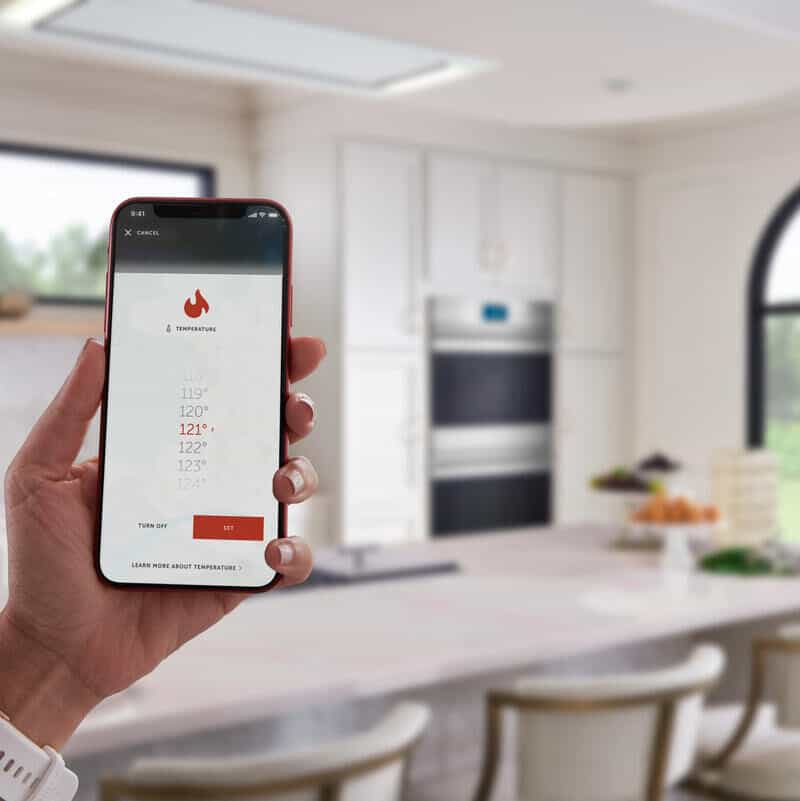 Phone featuring wolf appliances temperature control app