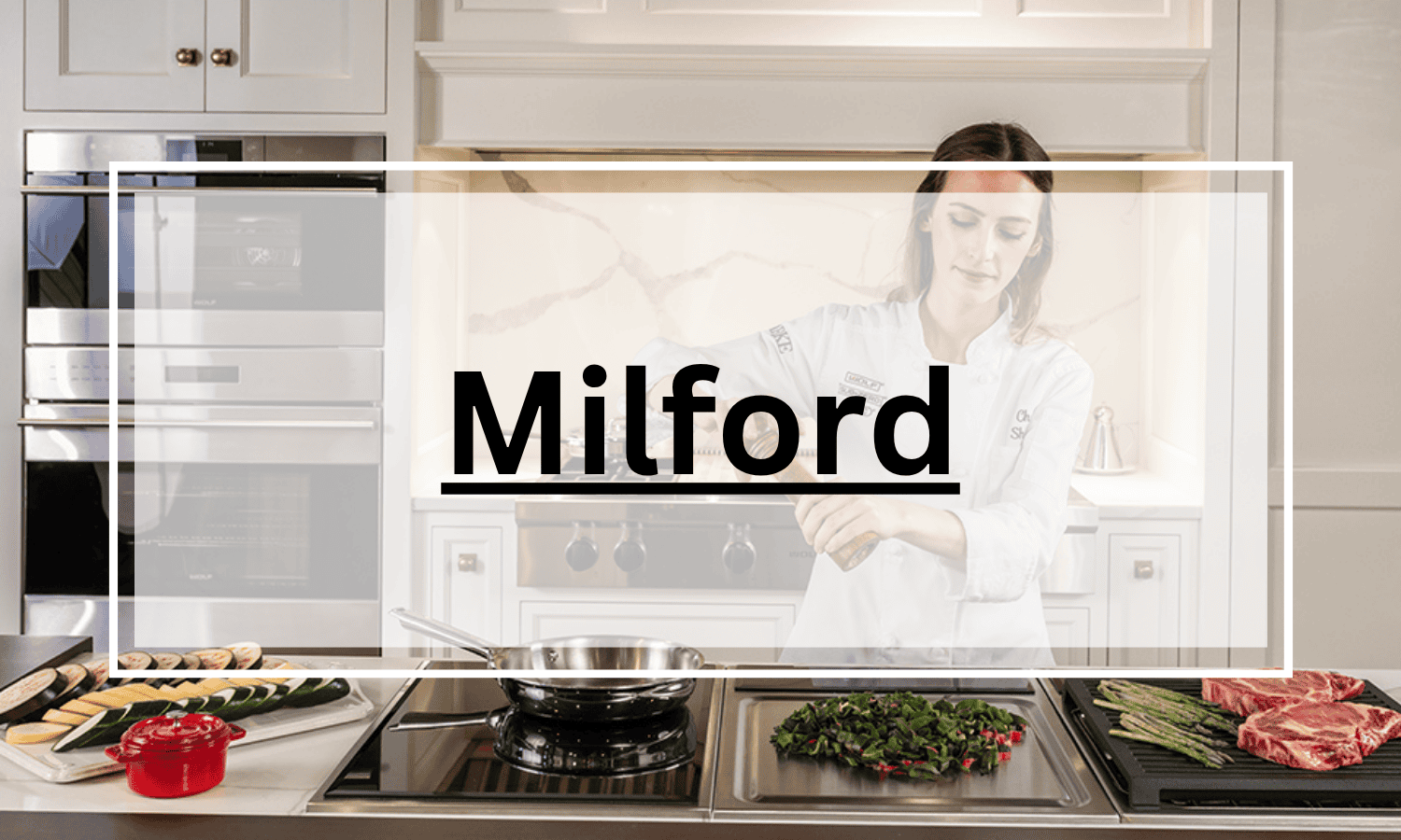 A chef seasons food at a modern kitchen counter featuring Wolf appliances, surrounded by vegetables and steak, with the word "Milford" overlaid in bold text.