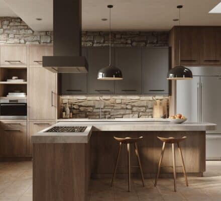 Modern kitchen with wood cabinets, stone walls, island with two stools, built-in appliances including an induction range, pendant lights, and large windows letting in natural light.