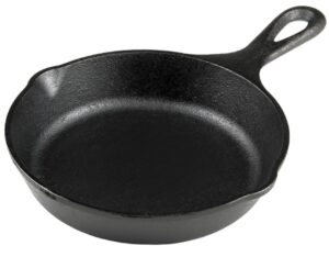 A black cast iron skillet with a handle and two pouring spouts, this versatile piece of cookware is shown on a plain white background.