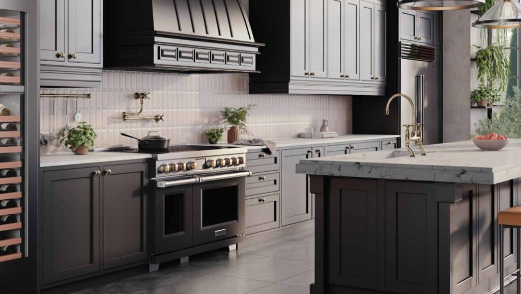 Modern luxury kitchen with dark cabinets, marble countertops, a large stove, brass fixtures, and potted plants on the backsplash under natural light from a nearby window.