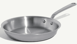 A stainless steel frying pan with a long handle and two rivets, this versatile piece of cookware is shown on a plain white background.