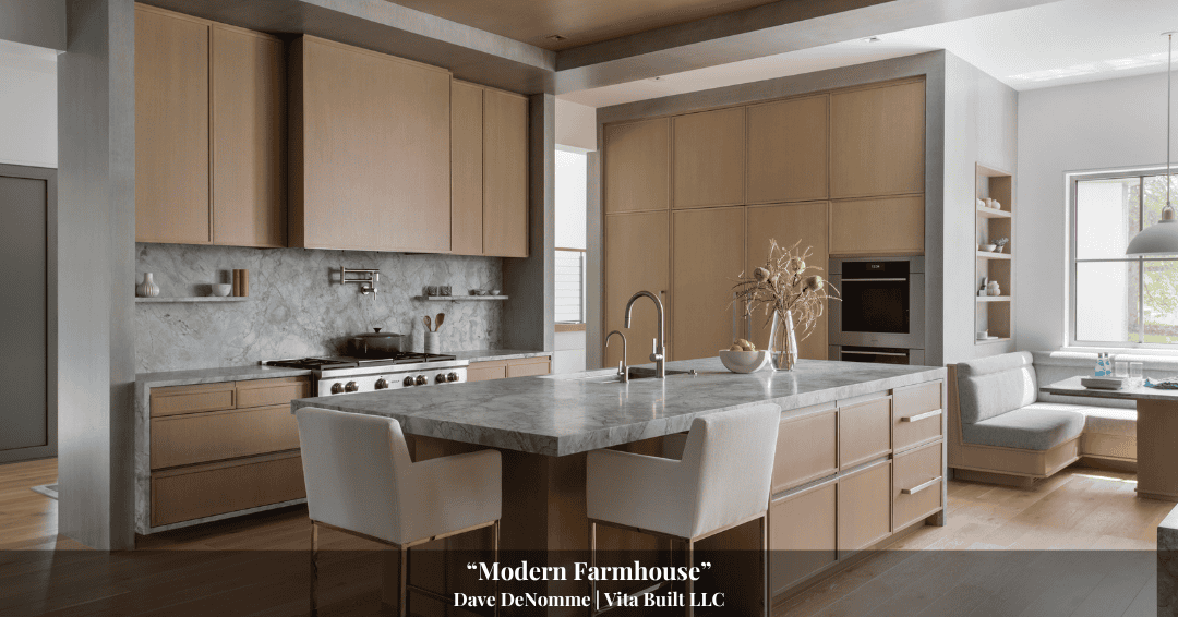 Spacious modern farmhouse kitchen with light wood cabinets, gray marble countertops, stainless steel appliances, island with sink, and adjacent sitting area with sofa—perfect for sharing stories from Clarke History.