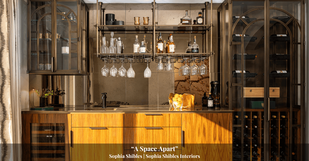 Home bar with wood cabinetry, glassware, and bottles on shelves, wine storage racks on both sides, and under-cabinet lighting—a timeless design inspired by Clarke History.